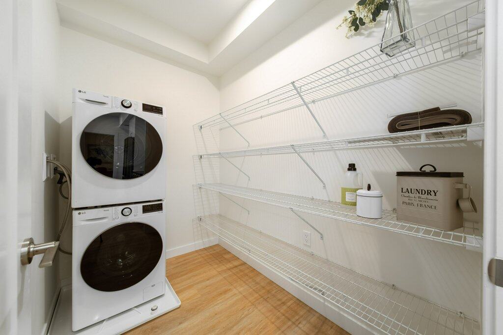 in-suite laundry in a two bed + den suite at Three Robins Riverside, independent senior living in St. Albert