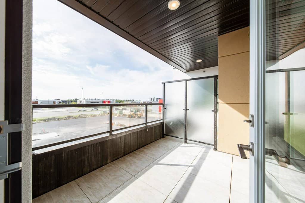 Balcony of a two+den suite at Three Robins Riverside, independent senior living in St. Albert