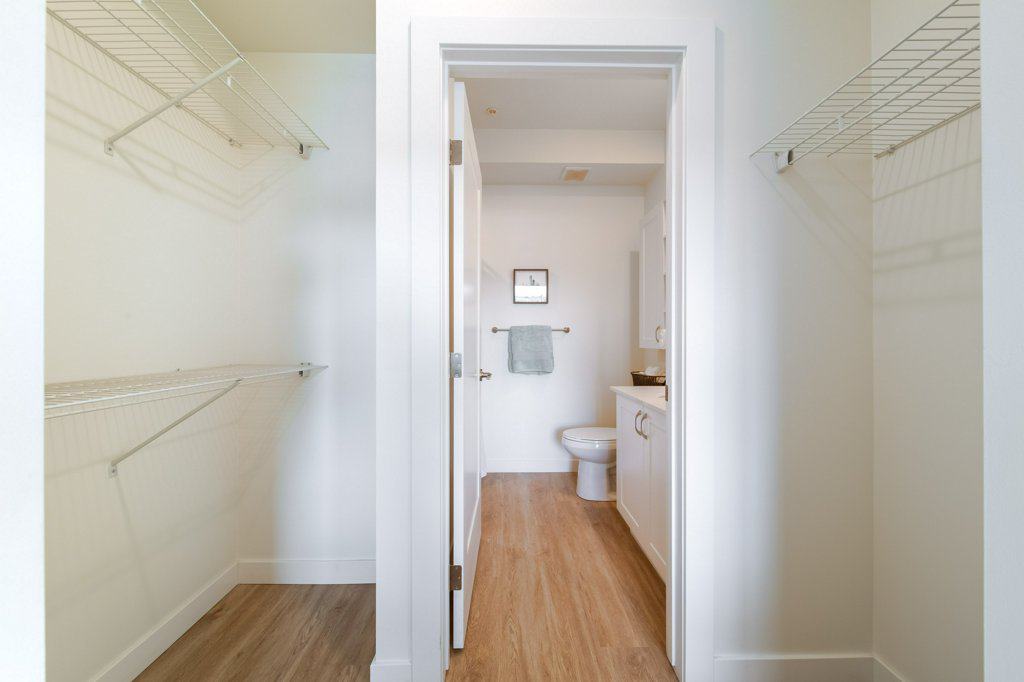 Walk-in closet in a suite at Three Robins Riverside, independent senior living in St. Albert