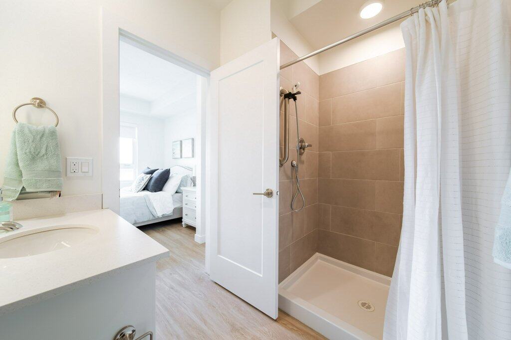 Accessible bathroom in a suite at Three Robins Riverside, independent senior living in St. Albert