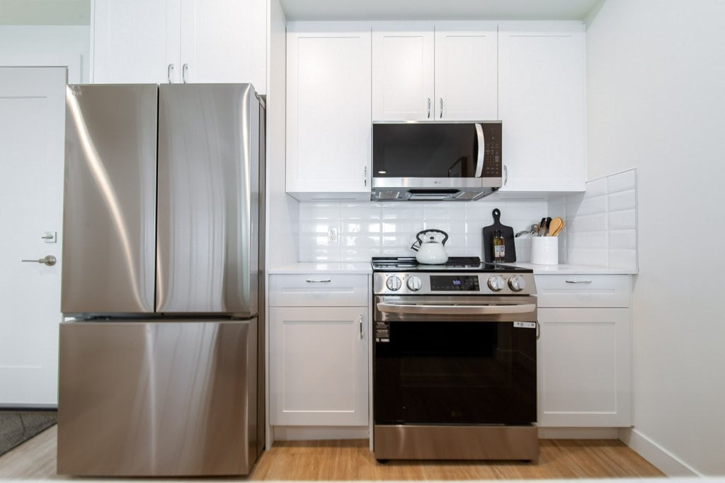 Kitchen in a two-bedroom suite at Three Robins Riverside, independent senior living in St. Albert