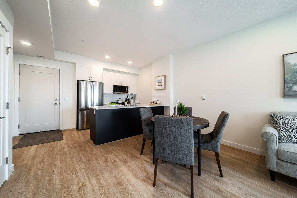 Dining Room in a two-bedroom suite at Three Robins Riverside, independent senior living in St. Albert