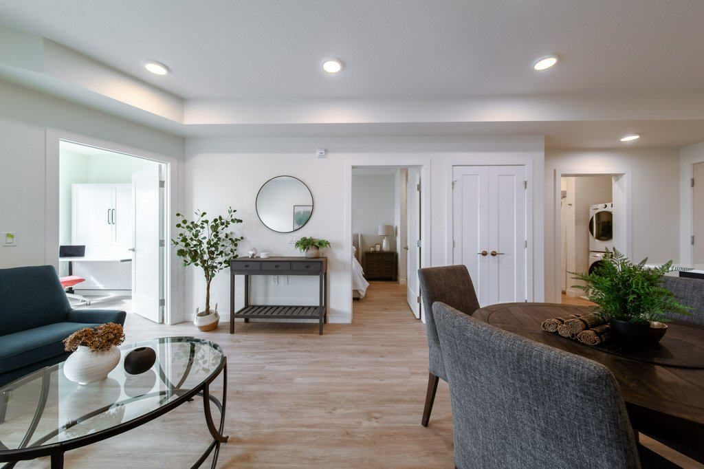 Living area in a two-bedroom suite at Three Robins Riverside, independent senior living in St. Albert