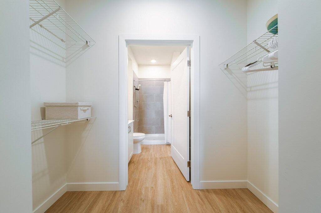 Walk-in closet in a 2-bedroom suite, Three Robins Riverside”