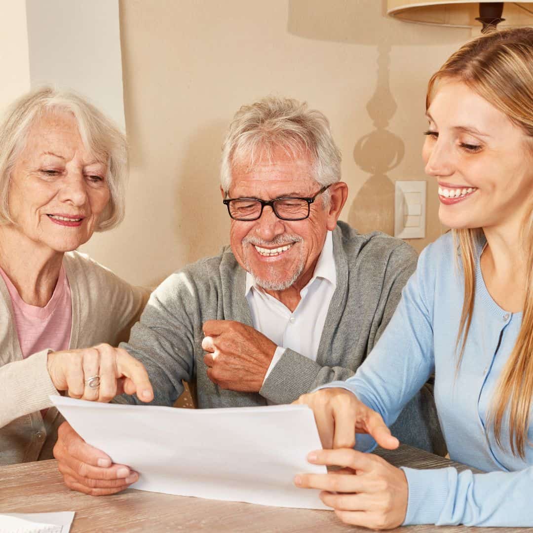 An older couple getting assistance from a Three Robins staff to help them downsize