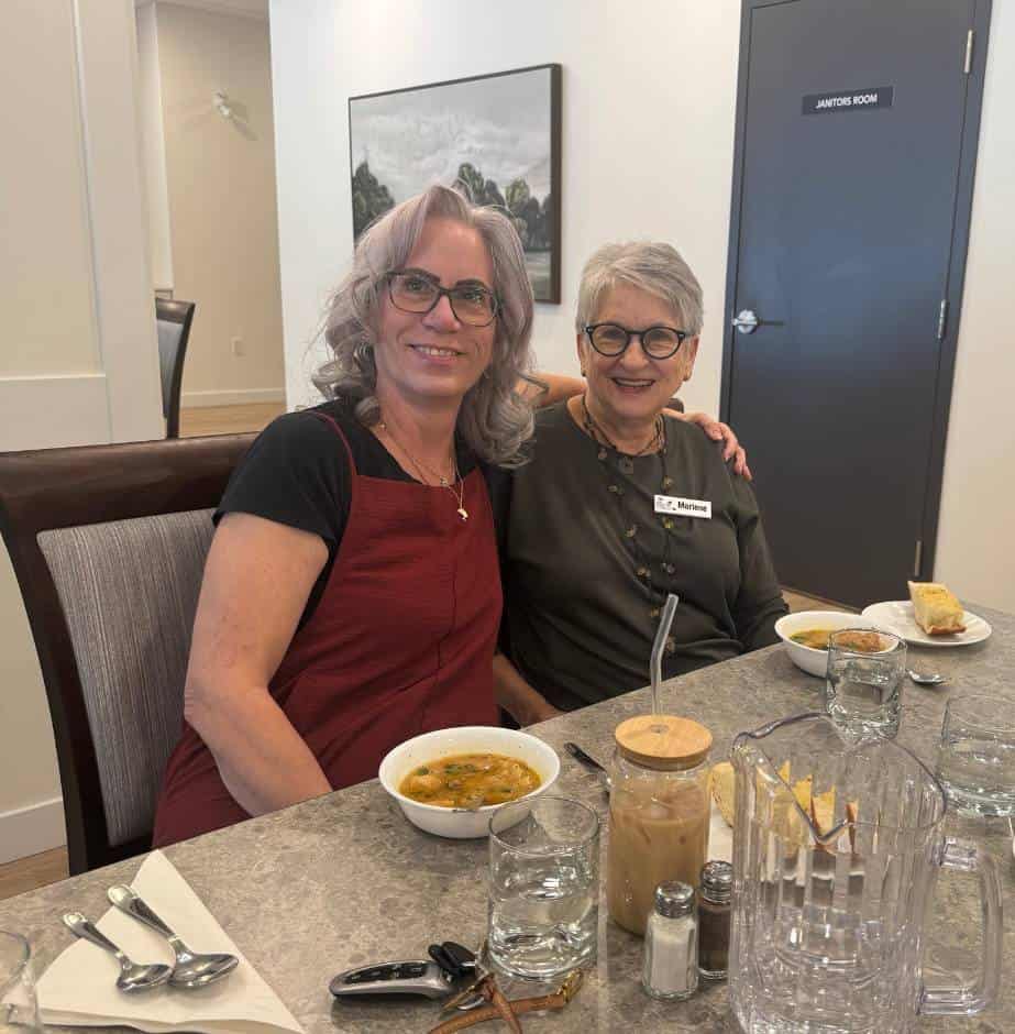 Two women enjoying a meal together.