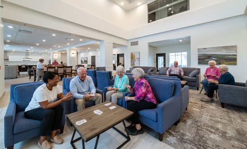 group of Three Robins Riverside residents enjoying the community lounge