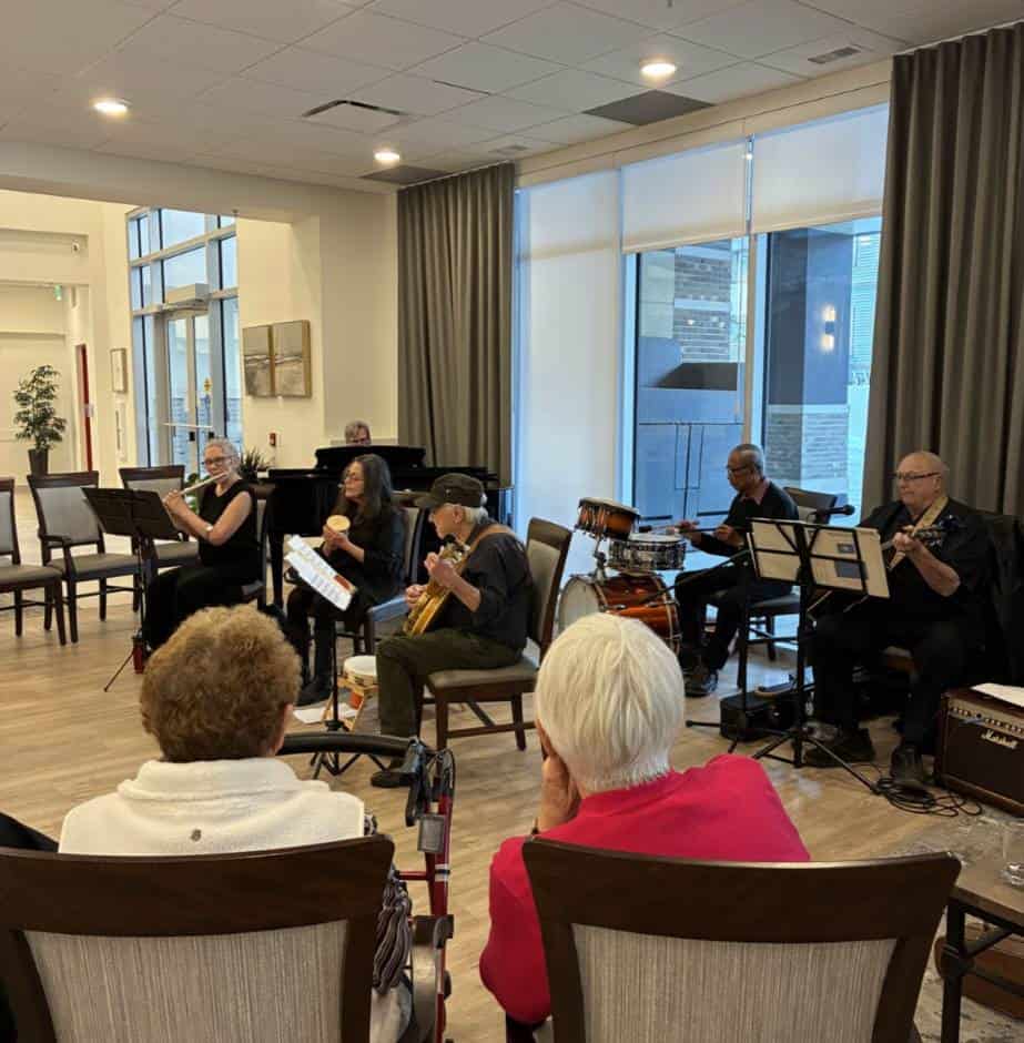 Residents enjoying live music performance.