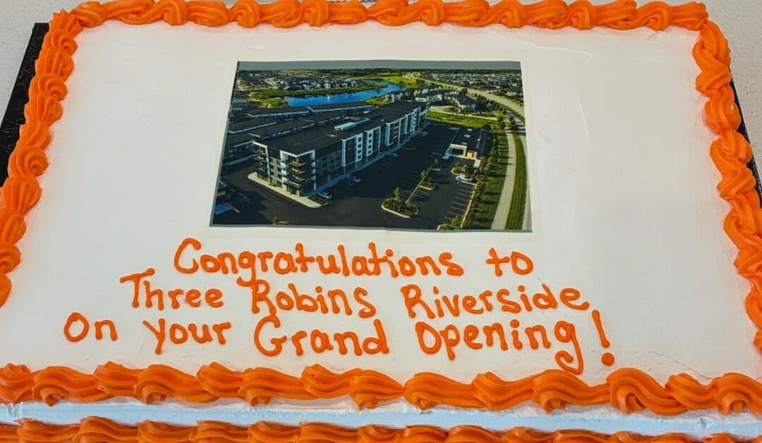 Three Robins Riverside St. Albert grand opening event with community gathering.